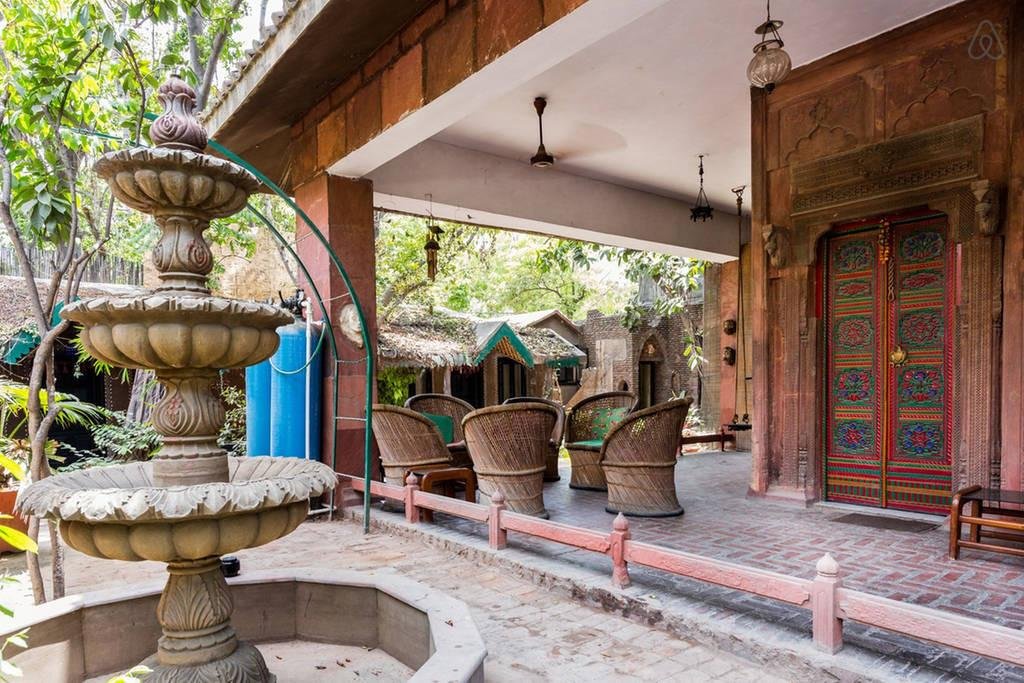 Courtyard seating and heritage door at Malhar Haveli